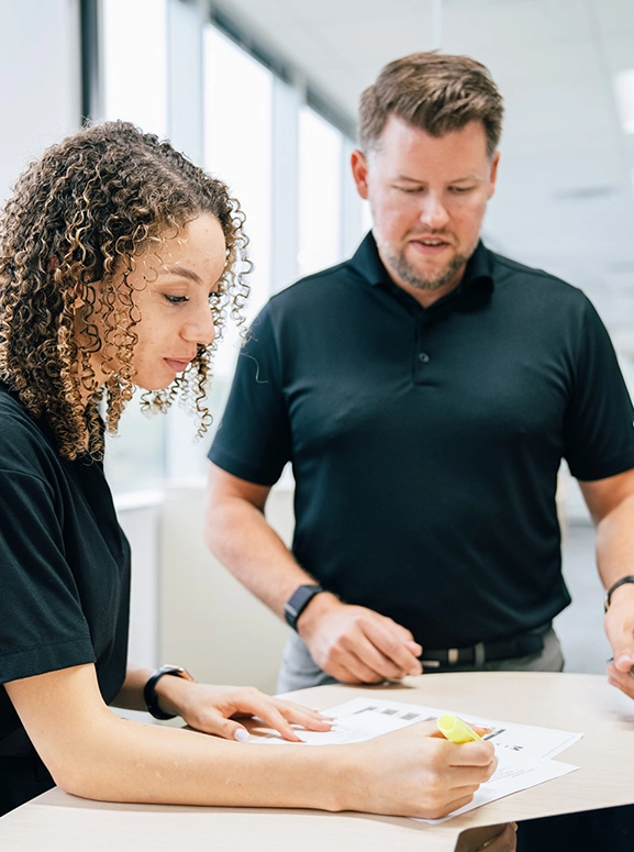 woman and man looking at forms for renting a vehicle in Pittsburgh